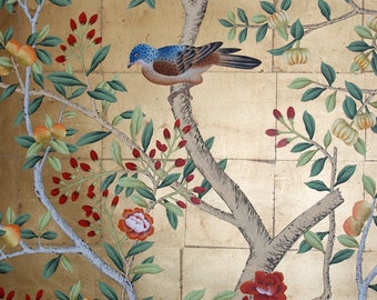 May include: A decorative wall panel with a gold background and a painted design of trees, birds, and flowers. The trees have light brown trunks and branches with green leaves, red berries, and orange fruit. A blue and brown bird perches on a branch.