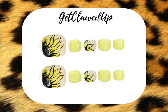 Yellow French Manicure With A Design On Female Hand With Sunflower Closeup.  Stock Photo, Picture and Royalty Free Image. Image 66806798.