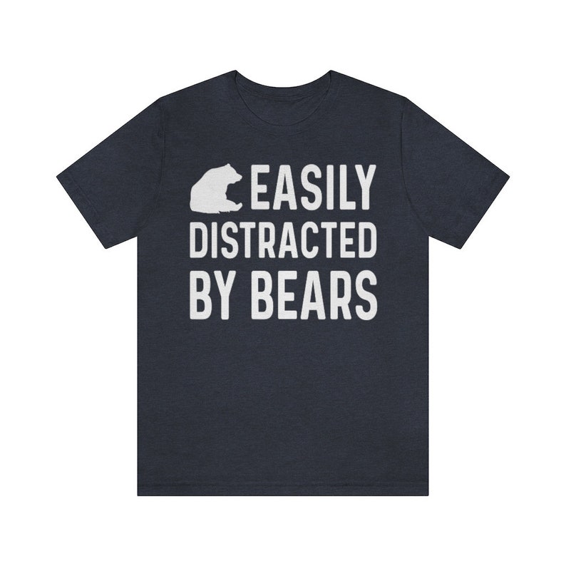May include: A dark blue t-shirt with a white bear silhouette and the text "EASILY DISTRACTED BY BEARS".