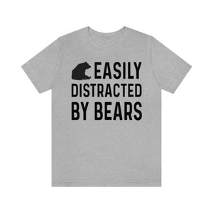 May include: A heather grey t-shirt with a black bear silhouette and the text "EASILY DISTRACTED BY BEARS".