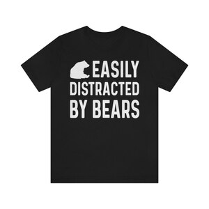 May include: Black t-shirt with a white bear silhouette and the text "EASILY DISTRACTED BY BEARS".