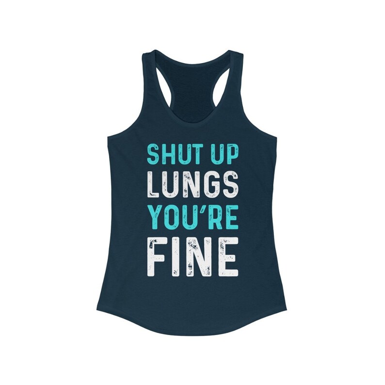 May include: A navy blue tank top with the text "SHUT UP LUNGS YOU'RE FINE" in white and turquoise lettering.