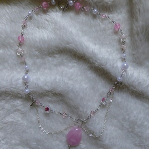 pink pearly necklace with stars charms