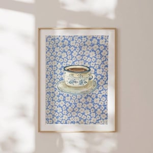 May include: A blue and white teacup with a floral pattern sits on a saucer against a background of white flowers on a blue background.
