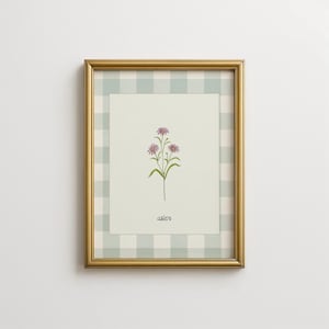 Może przedstawiać: Oprawiony wydruk z botaniczną ilustracją kwiatów astrów. Grafika umieszczona jest na jasnym, zielono-białym tle w kratkę, w złotej ramie. Słowo "aster" jest napisane pod kwiatami.
