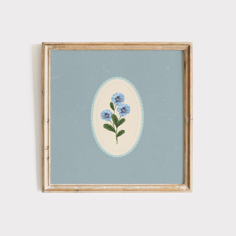 May include: A framed print of a blue flower with a white and blue border on a light blue background.