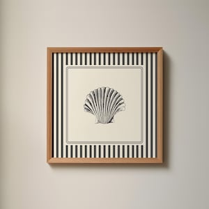 May include: A framed print with a black and white striped border and a black and white illustration of a seashell in the center.