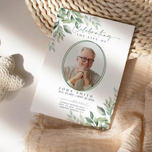 May include: A white memorial card with green watercolor leaves and a photo of a man in a white shirt. The text reads "Celebrating the Life of John Smith Aug. 30, 1975 - Sept. 29, 20XX  you will be missed" and includes information about a memorial service.