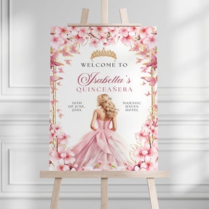 Puede incluir: Un cartel de bienvenida para una Quinceañera con un diseño floral rosa y una corona dorada. El texto dice "Bienvenido a la Quinceañera de Isabella" con la fecha "10 de junio de 20XX" y la ubicación "Majestic Haven Hotel".