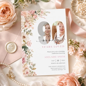 May include: A rectangular birthday invitation card featuring a floral border of pink and white flowers. The card displays the large number 90 with two circular photo cutouts, the text ninety, YEARS LOVED, and event details for Adelaide Smith.