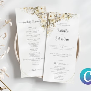 May include: Wedding ceremony programme with a white floral border. The programme lists the officiant, bride's parent, groom's parent, maid of honour, bridesmaids, best man, groomsmen, flower girl and ring bearer, and ushers. The programme also includes the date, time, and location of the ceremony. The ceremony order is listed on the right side of the programme.