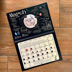 May include: A black and white 2026 March calendar with astrological themes. Features a Worm Moon graphic, zodiac symbols, and a calendar grid with moon phase illustrations. Includes text about energies, spell work, and affirmations.