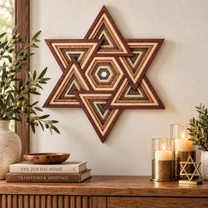 May include: A wall-mounted Star of David art piece constructed from layered wood in shades of deep red, light tan, and dark brown. The geometric design features concentric triangles and a central hexagon, creating a dimensional, multi-layered effect.