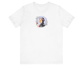 May include: White t-shirt featuring a circular graphic of a woman wearing a floral crown and a black veil. The graphic includes the text "Live as not to fear death."