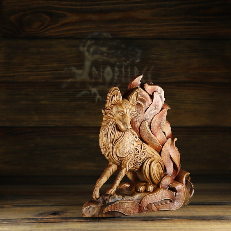 May include: A wooden sculpture of a fox with intricate details, carved in a flame-like design. The fox is sitting on a base with a swirling pattern.