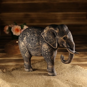 Asian folklore inspired wood carving, standing mandala elephant icon with intricate tribal lines and framing.
