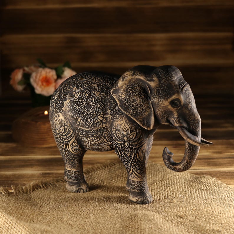 Asian folklore inspired wood carving, standing mandala elephant icon with intricate tribal lines and framing.