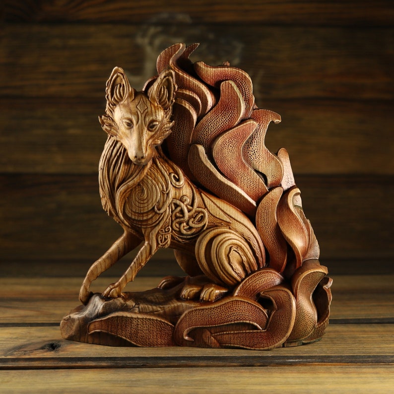 May include: A wooden sculpture of a fox with a large, elaborate tail made of swirling, intricate patterns. The fox is carved in a realistic style with detailed features and a lifelike pose.