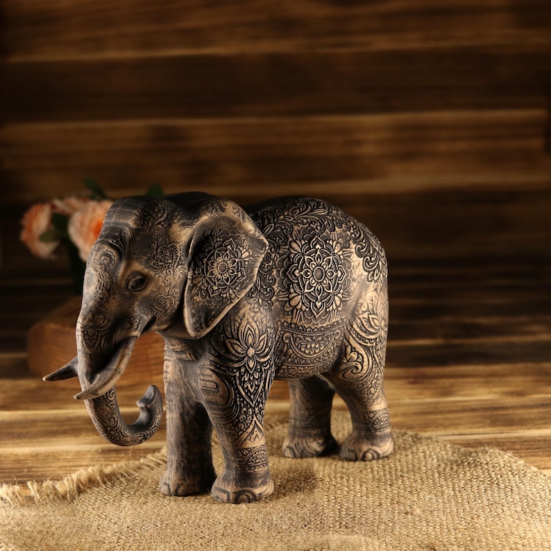 Handcrafted oriental guardian totem featuring a textured hairy elephant, scorched wood accent finishing.