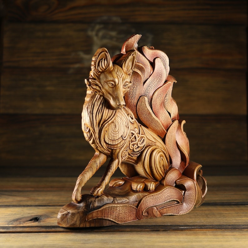 May include: A wooden sculpture of a fox with intricate carvings and a flowing tail. The fox is depicted with a fierce expression and a detailed, ornate design.