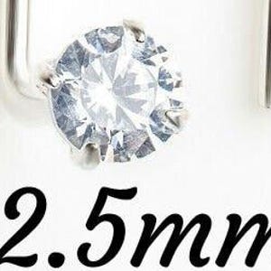 May include: Three silver earring studs with clear round stones. The stones are 3mm, 2.5mm, and 2mm in diameter.