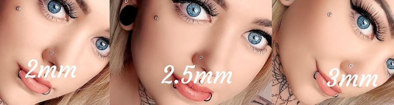 May include: Close-up of three different sizes of nose rings, 2mm, 2.5mm, and 3mm. The rings are made of silver and are worn by a person with blonde hair and blue eyes.