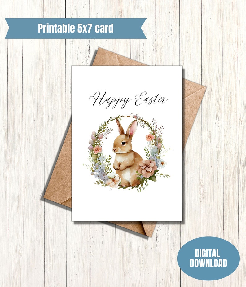 May include: Printable 5x7 card with a watercolor illustration of a brown bunny rabbit sitting in a wreath of flowers. The text "Happy Easter" is written in cursive above the bunny.