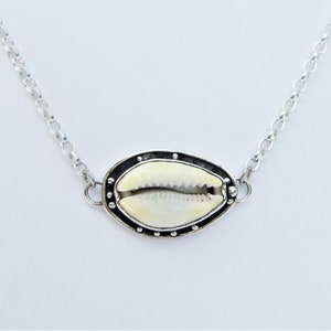Cowrie shell with oxidised edge Pendant