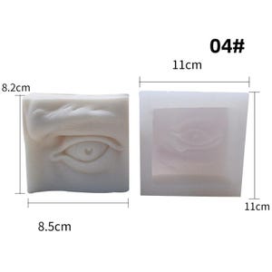 May include: Two white silicone molds, one with a sculpted eye design and the other a negative impression. The eye mold measures 8.5 cm x 8.2 cm x 11 cm. The text "04#" is visible.
