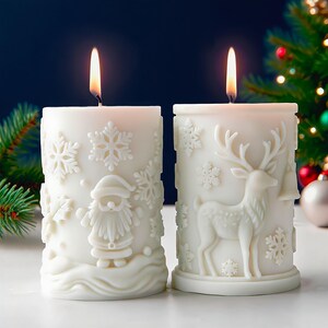 May include: Two lit, white pillar candles with festive designs. One candle features a Santa Claus figure and snowflakes, the other a reindeer and snowflakes. The candles are cylindrical and have a textured, embossed appearance.