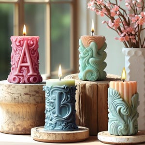 May include: Four lit, decorative pillar candles in shades of pink, green, and peach. Each candle features a letter or ornate design. The candles are on wooden stands, with a vase of pink flowers in the background.