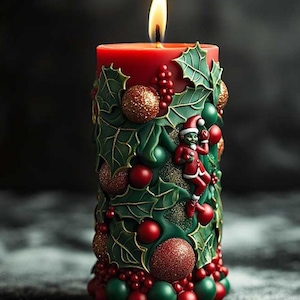 May include: A lit red Christmas candle with green holly and red berry decorations. The candle features a small Santa Claus figure and gold glitter accents. The candle is a festive holiday decoration.