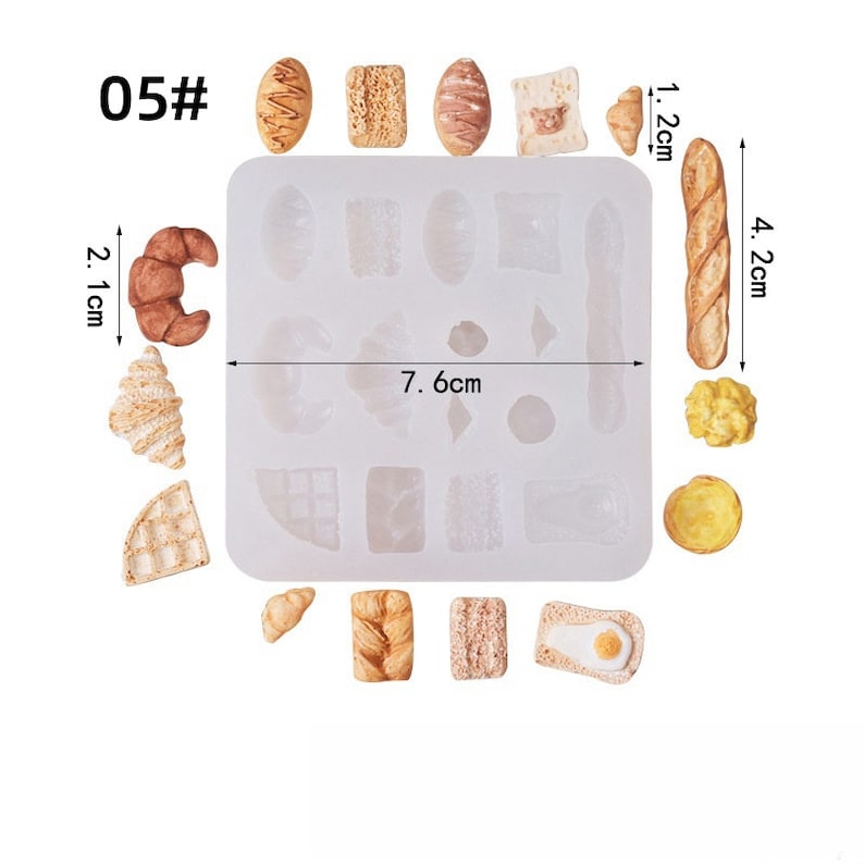 May include: A silicone mold with various miniature bread shapes, including croissants, a baguette (4.2 cm), and a waffle. The mold itself measures 7.6 cm across. The image also shows several finished bread miniatures, with a croissant measuring 2.1 cm.