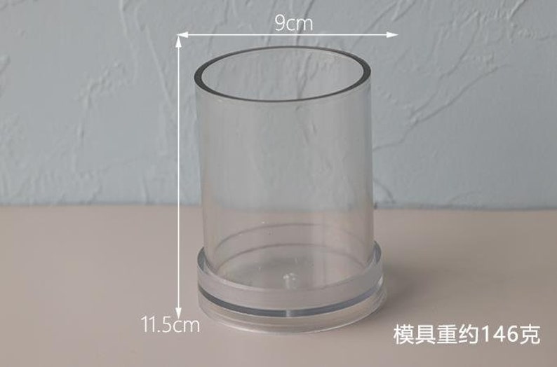 May include: A clear, cylindrical container with a 3.5-inch diameter and a height of 4.5 inches. The base has a frosted band. The text in the image says the mold weighs approximately 5.1 ounces.