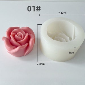May include: A pink rose-shaped candle and a white silicone mould. The mould is 7.4 cm wide and 4 cm tall. The candle is 7.3 cm wide. The number "01#" is printed in the top left corner. The candle has a detailed rose petal design.