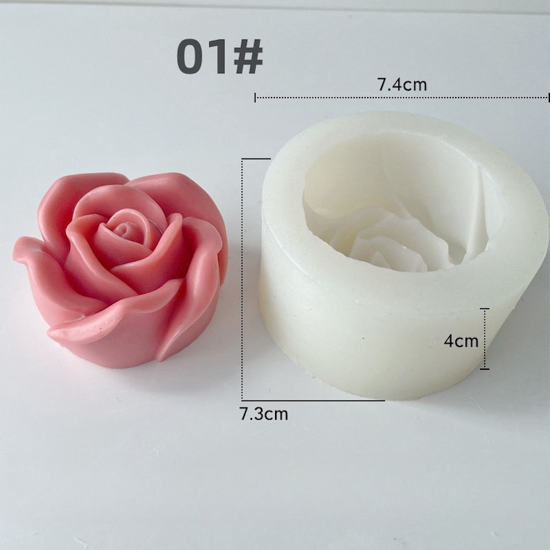 May include: A pink rose-shaped candle and a white silicone mould. The mould is 7.4 cm wide and 4 cm tall. The candle is 7.3 cm wide. The number "01#" is printed in the top left corner. The candle has a detailed rose petal design.