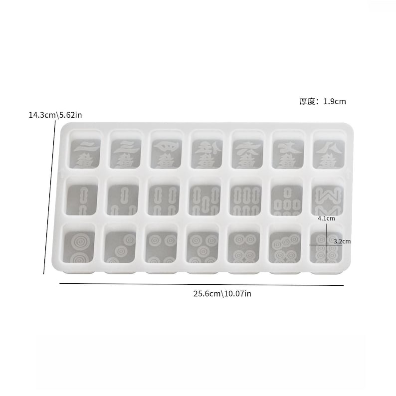 May include: A clear, rectangular mold for crafting, featuring 24 individual compartments. The mold measures 10.07 inches long, 5.62 inches wide, and 0.75 inches thick. Each compartment is designed with various shapes and symbols, perfect for creating custom game pieces.