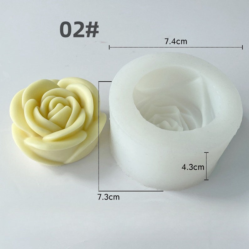 May include: A light yellow rose-shaped soap and a white silicone mould. The mould is 7.4 cm wide and 4.3 cm tall. The soap is 7.3 cm wide. The text "02#" is in the upper left corner.