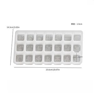 May include: A clear, rectangular silicone mold for crafting, featuring 20 individual square and rectangular compartments. The mold measures 10.07 inches long, 5.62 inches wide, and 0.75 inches thick. Each compartment has a unique embossed design.
