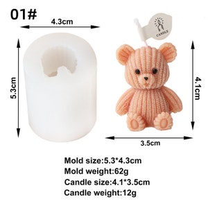 May include: A white cylindrical silicone mold next to a peach-colored bear-shaped candle. The candle has a knitted texture and a small tag that says "CANDLE". The mold is 5.3cm x 4.3cm. The candle is 4.1cm x 3.5cm.