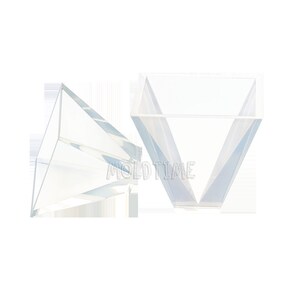 May include: Two clear, geometric, prism-shaped moulds. The moulds are transparent and have a V-shaped design. The text "MOLD TIME" is visible on the moulds.