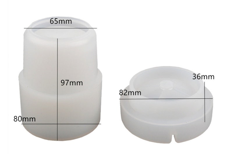 Puede incluir: Dos componentes de pl&aacute;stico blanco. Uno es cil&iacute;ndrico, de 97 mm de alto, 80 mm de ancho y 65 mm de di&aacute;metro en la parte superior. El otro es un disco, de 36 mm de alto y 82 mm de di&aacute;metro. Ambos son probablemente partes de un producto m&aacute;s grande.