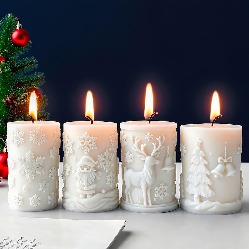May include: Four white Christmas candles with detailed embossed designs of snowflakes, Santa Claus, a reindeer, and a Christmas tree. Each candle is lit with a warm, flickering flame, creating a festive atmosphere. The candles are arranged in a row.
