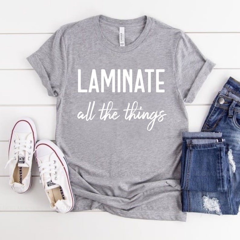 Puede incluir: Camiseta gris con el texto "Laminate all the things" en blanco.