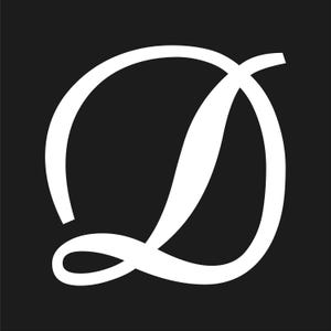 May include: A white, stylized letter "D" against a solid black background. The design features a flowing, cursive script with a large, rounded loop and a graceful, elongated stroke. The contrast between the white letter and the black backdrop creates a bold, eye-catching visual.