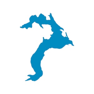 May include: A solid blue graphic of a landmass or island against a white background. The shape is irregular, with a long, curved section extending downwards. The overall form is abstract and stylized.