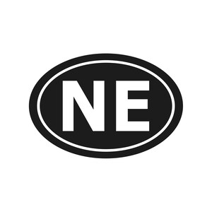 May include: A black and white oval sticker with the letters "NE" in bold white font. The letters are centered within the black oval, which is outlined with a thin white border.