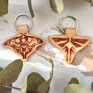 The Last of Us keychain - Fireflies and Ellie&#39;s moth