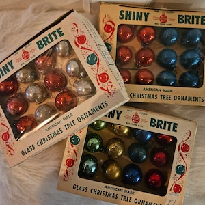 Box of One Dozen Small Colorful Vintage Shiny Brite Christmas tree ornaments.