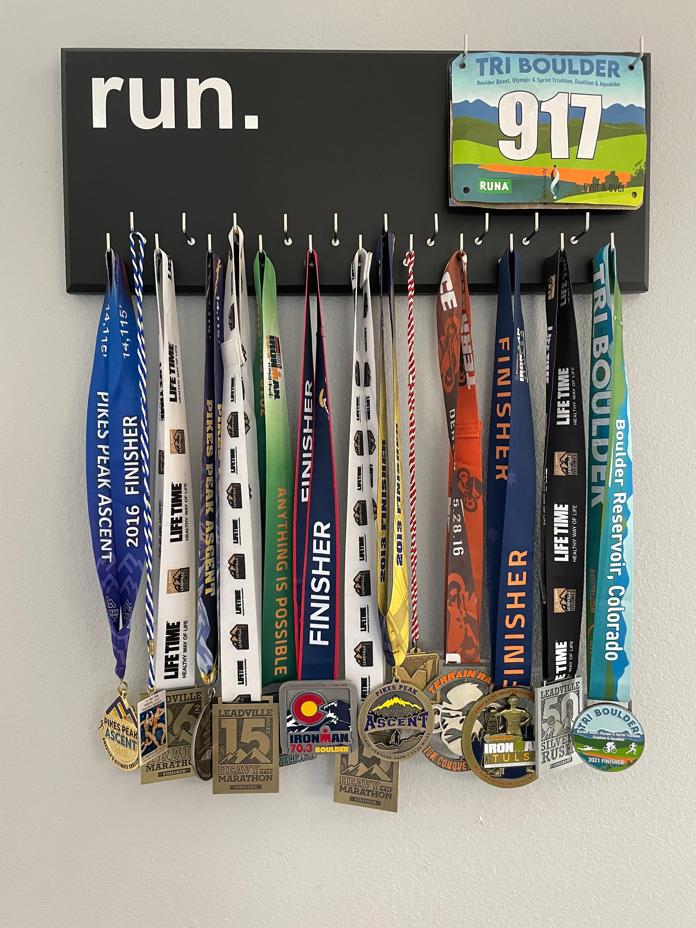 Running Medal Holder, gray or black with chrome "run." vinyl, 21 hooks and BIB holder
